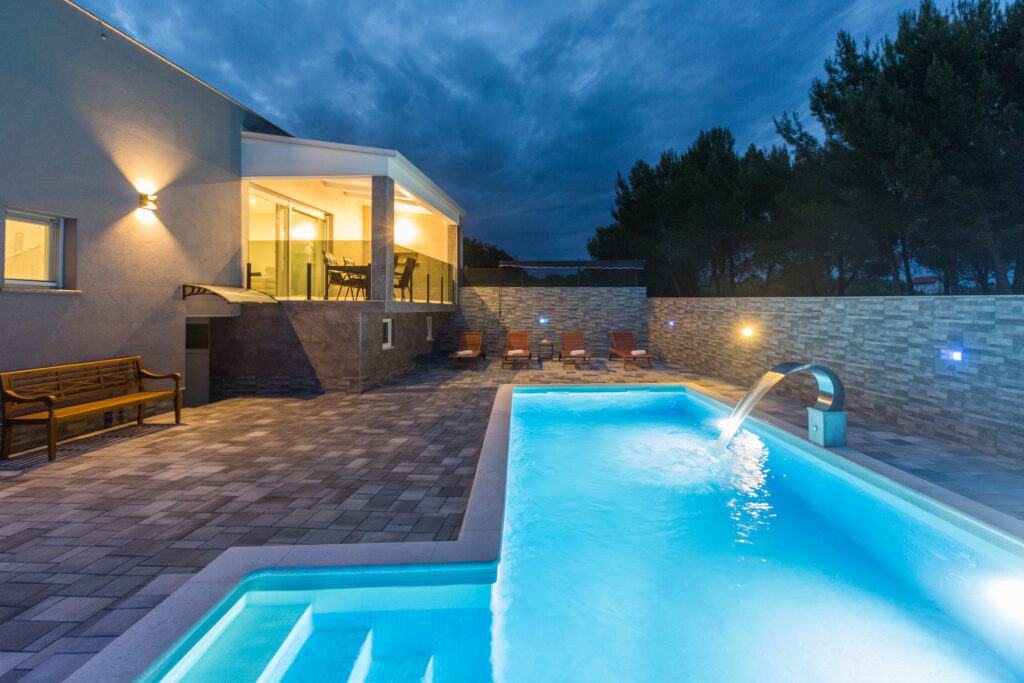 Pool and tanning area view by the villa.